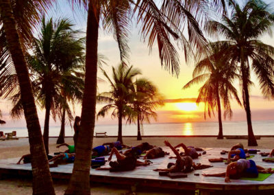 Practicing yoga in the sunset